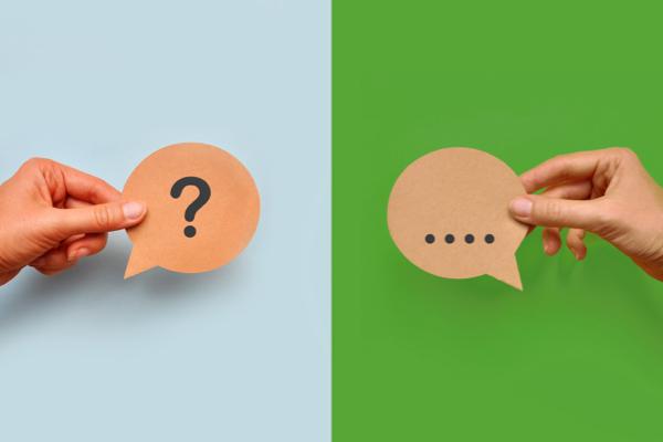 Speech bubbles - one with three dots, the other a question mark, symbolizing conversation