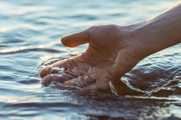 A hand touching water